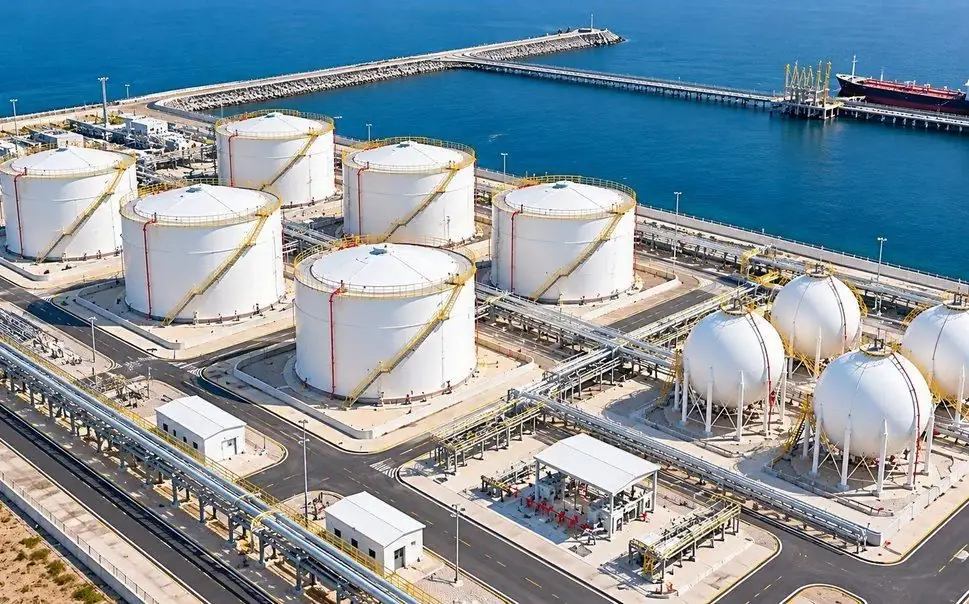 Aerial view of a marine storage terminal with tanks, spheres and jetty